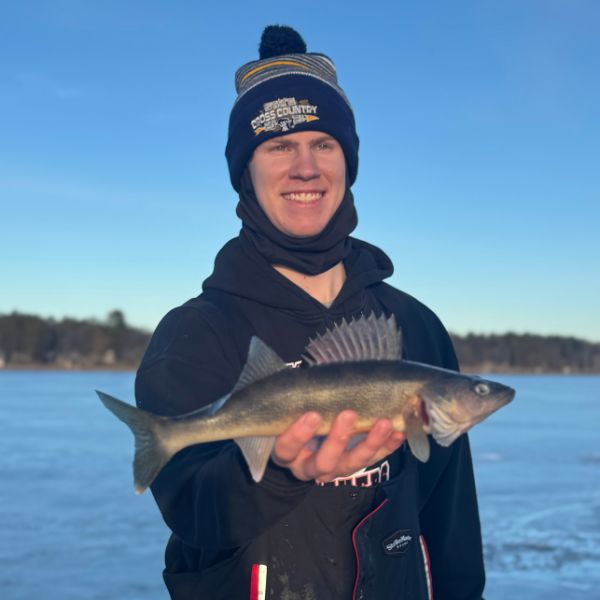 a man holding a fish